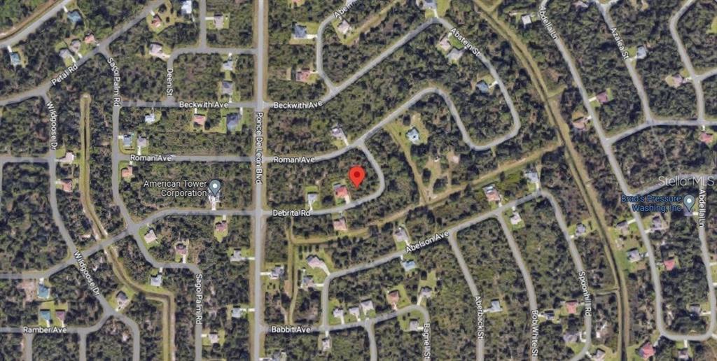 This is an aerial map view of a residential neighborhood with a red location pin — 0 DE BRITA ROAD, NORTH PORT, FL