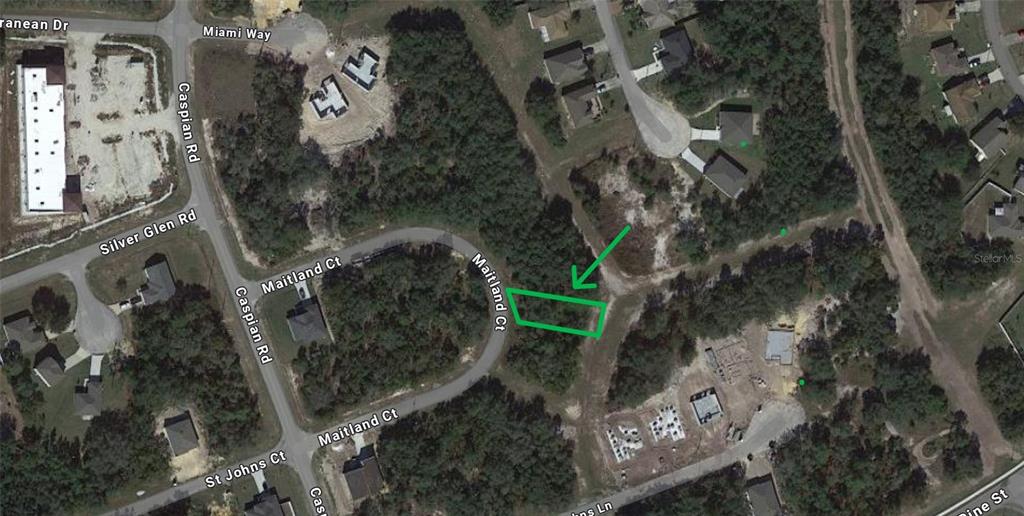 This is an aerial map showing a vacant lot highlighted in green on Maitland Court — 419 MAITLAND COURT, KISSIMMEE, FL