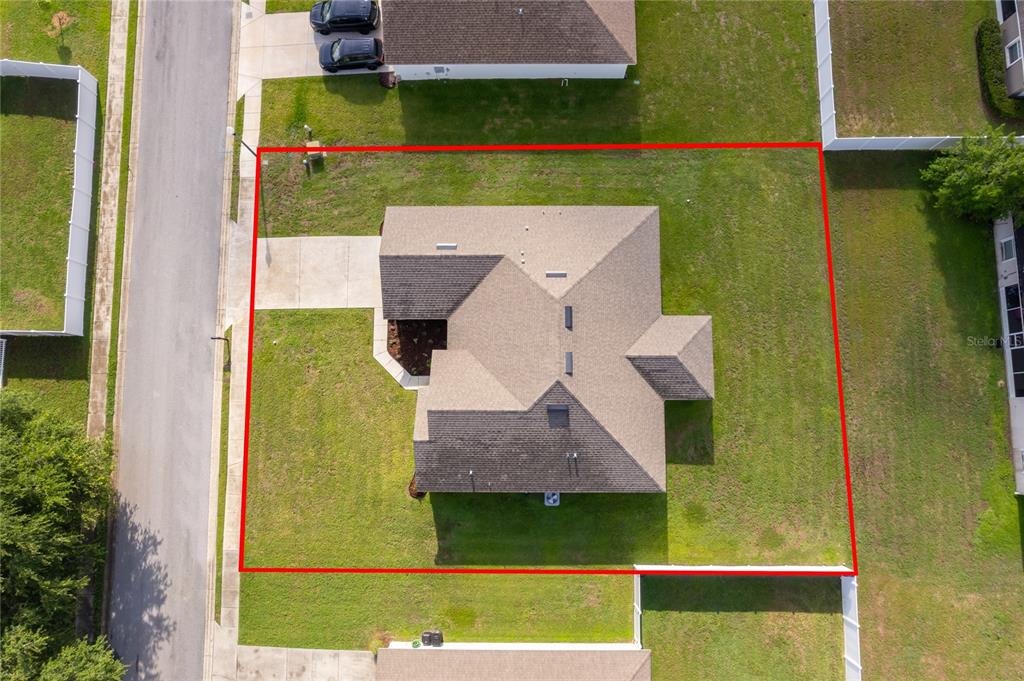 An aerial view shows a single-family house with a shingled roof on a grassy lot — 226 NW 44TH STREET, OCALA, FL