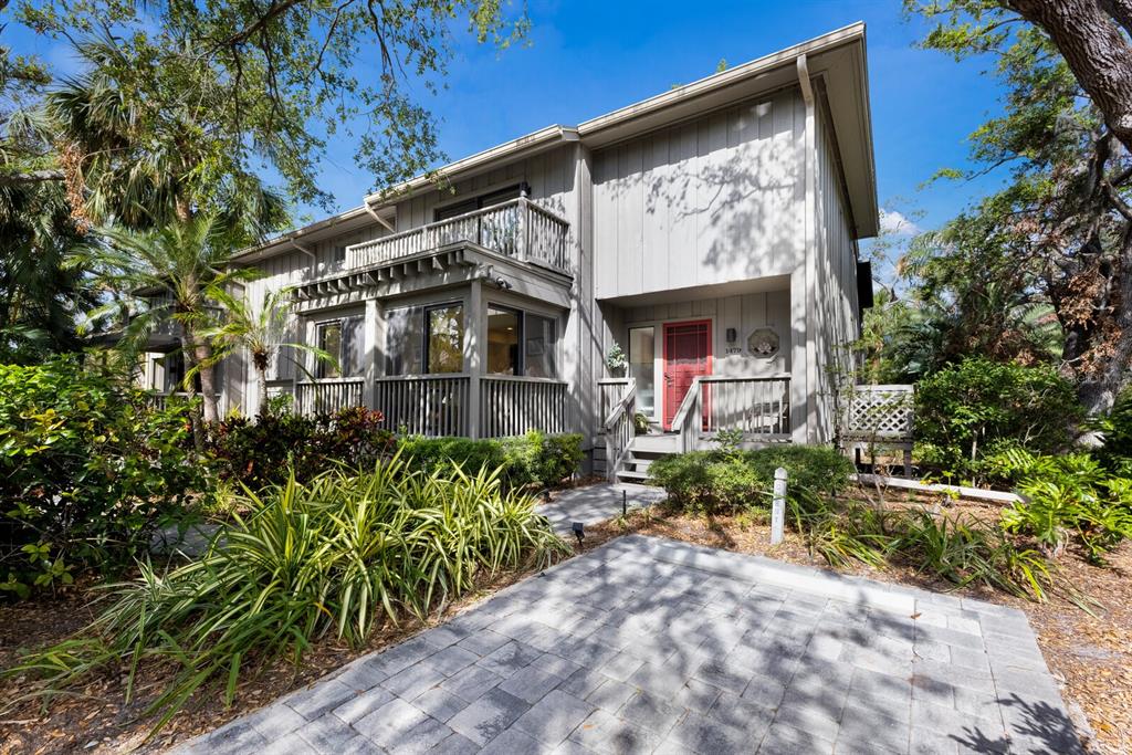 A two-story gray house with a red front door and a paved driveway — 1479 LANDINGS CIRCLE UNIT 41, SARASOTA, FL