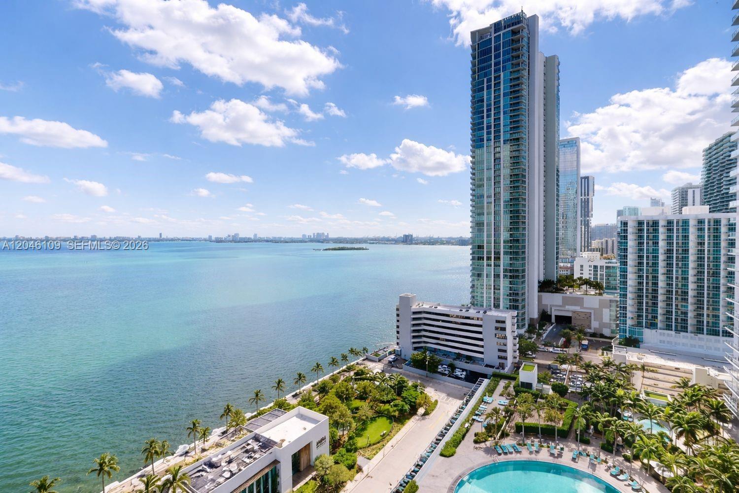 An elevated view of a coastal city skyline, a large bay, and a swimming pool area — 650 NE 32nd St # 2005, Miami FL 33137, MIAMI, FL