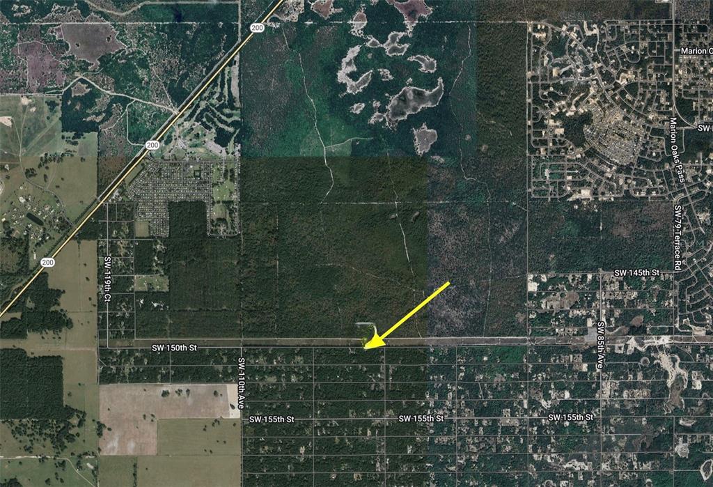 This is an aerial map showing a plot of land marked by a yellow arrow — Track 28 SW 150TH STREET, DUNNELLON, FL