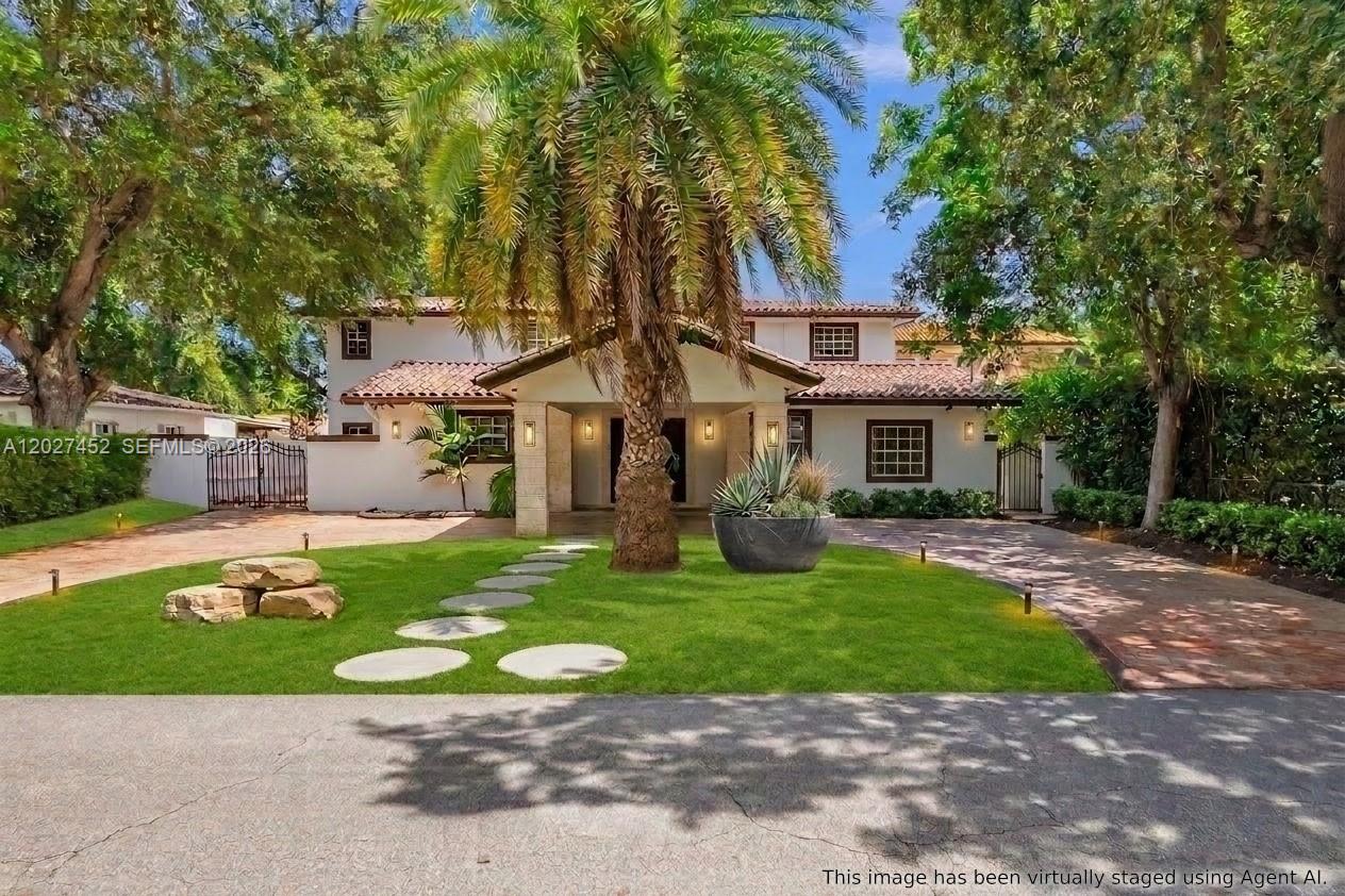 A two-story house with a tiled roof, palm tree, and circular stone path in front — 6284 SW 26th St, Miami FL 33155, MIAMI, FL