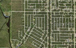 This is an aerial map view of a residential neighborhood with undeveloped wooded lots — 3088 ELDORADO LANE, PORT CHARLOTTE, FL
