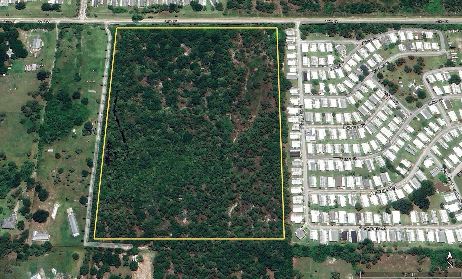 An aerial view shows a large, rectangular wooded lot outlined in yellow next to residential streets — 8655 12th Street, Vero Beach FL 32966, VERO BEACH, FL