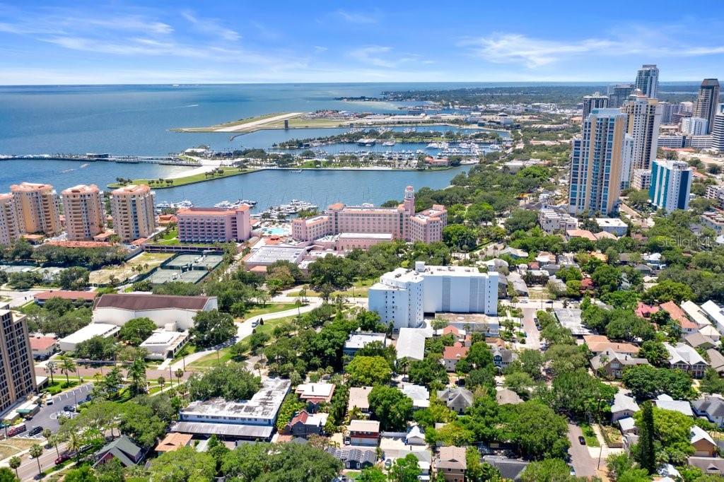An aerial view shows a coastal city with high-rise buildings, a marina, and a park — 2120 1ST STREET N, ST PETERSBURG, FL