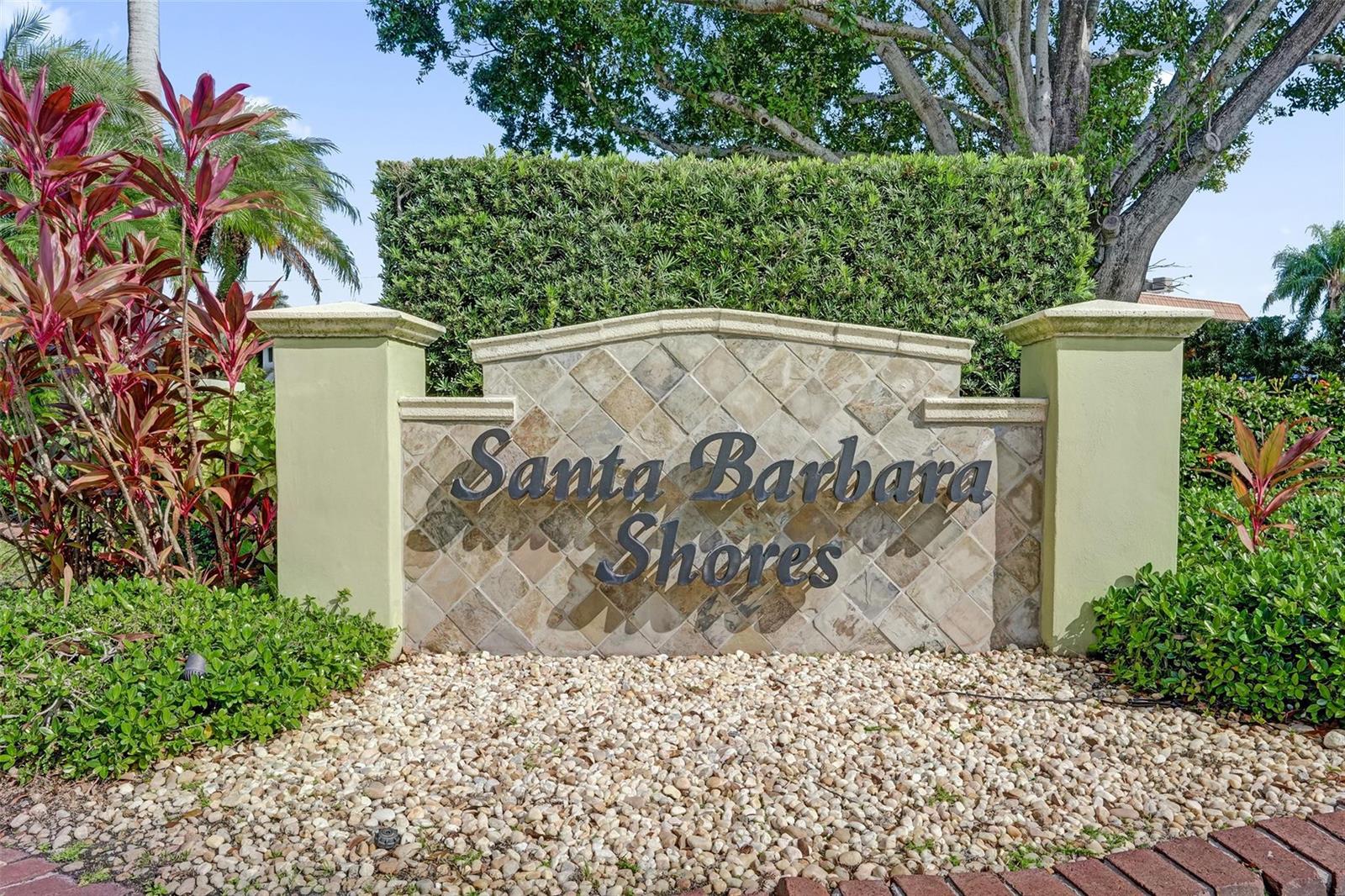 A stone monument sign for Santa Barbara Shores stands in front of a manicured hedge — 2201 SE 9th Street # 106, Pompano Beach FL 33062, POMPANO BEACH, FL
