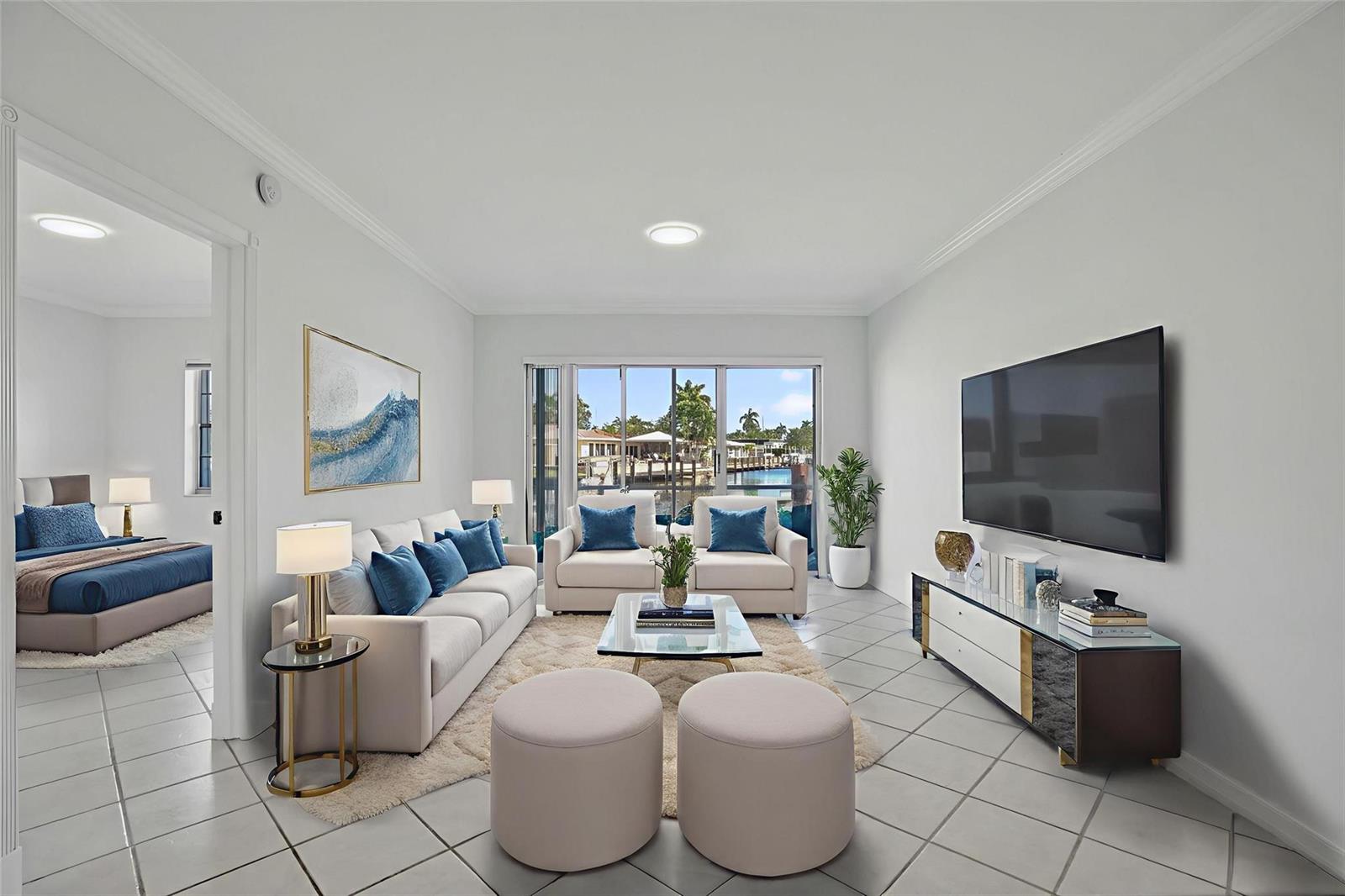 A living room with light tile floors, a sofa, two armchairs, and a waterfront view — 2201 SE 9th Street # 106, Pompano Beach FL 33062, POMPANO BEACH, FL