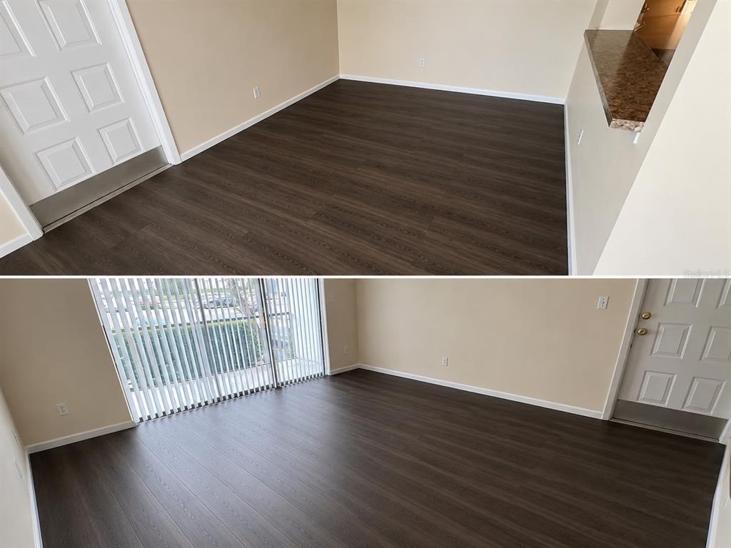 A room with dark wood-look flooring, beige walls, a white door, and sliding glass doors — 1612 S PINE RIDGE CIRCLE UNIT 1612, SANFORD, FL