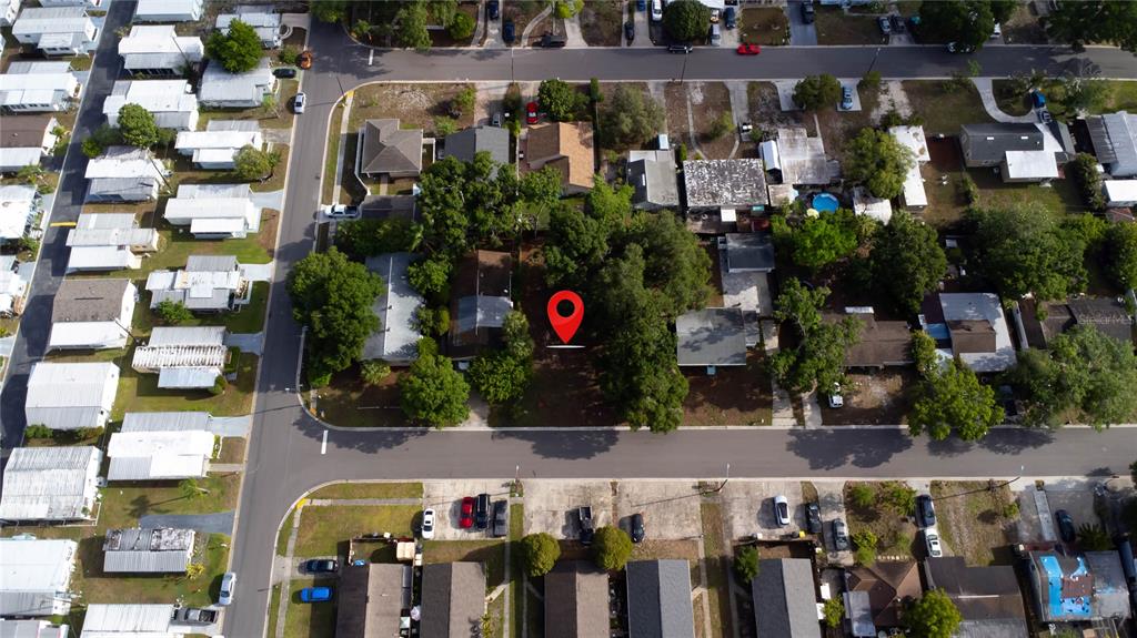 This aerial view shows a residential neighborhood with a red location pin on a lot — 1310 BROWNING STREET, CLEARWATER, FL