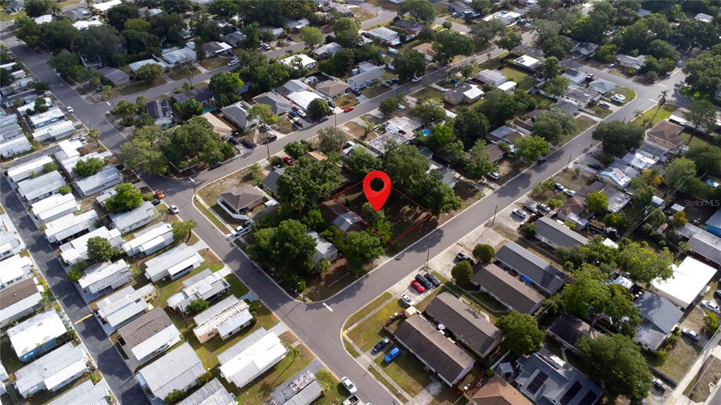 This aerial view shows a residential neighborhood with a red pin marking a vacant lot — 1310 BROWNING STREET, CLEARWATER, FL