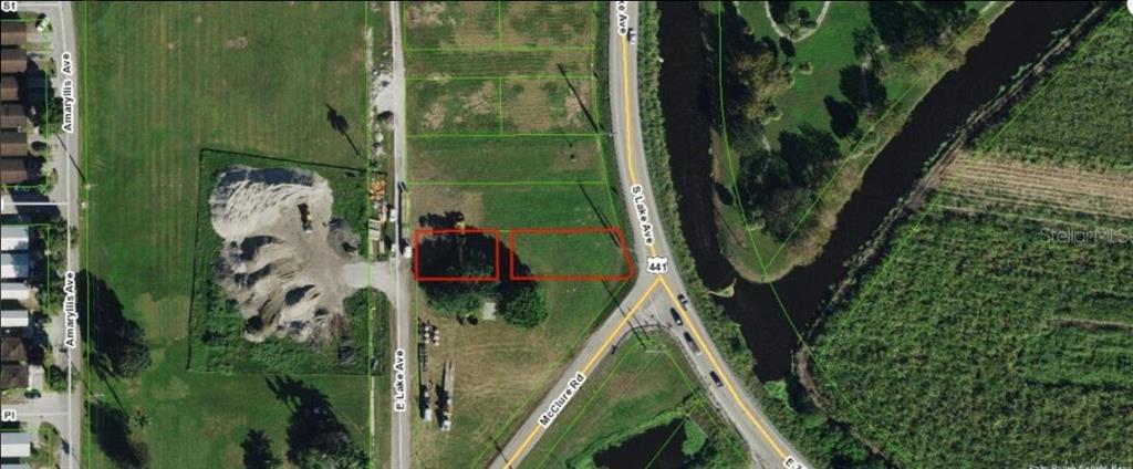 This aerial map shows two adjacent vacant lots outlined in red near a road intersection — RARDIN AVENUE, PAHOKEE, FL