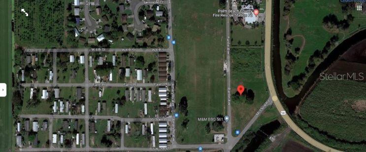 This is a satellite map view showing a vacant lot marked with a red pin — RARDIN AVENUE, PAHOKEE, FL