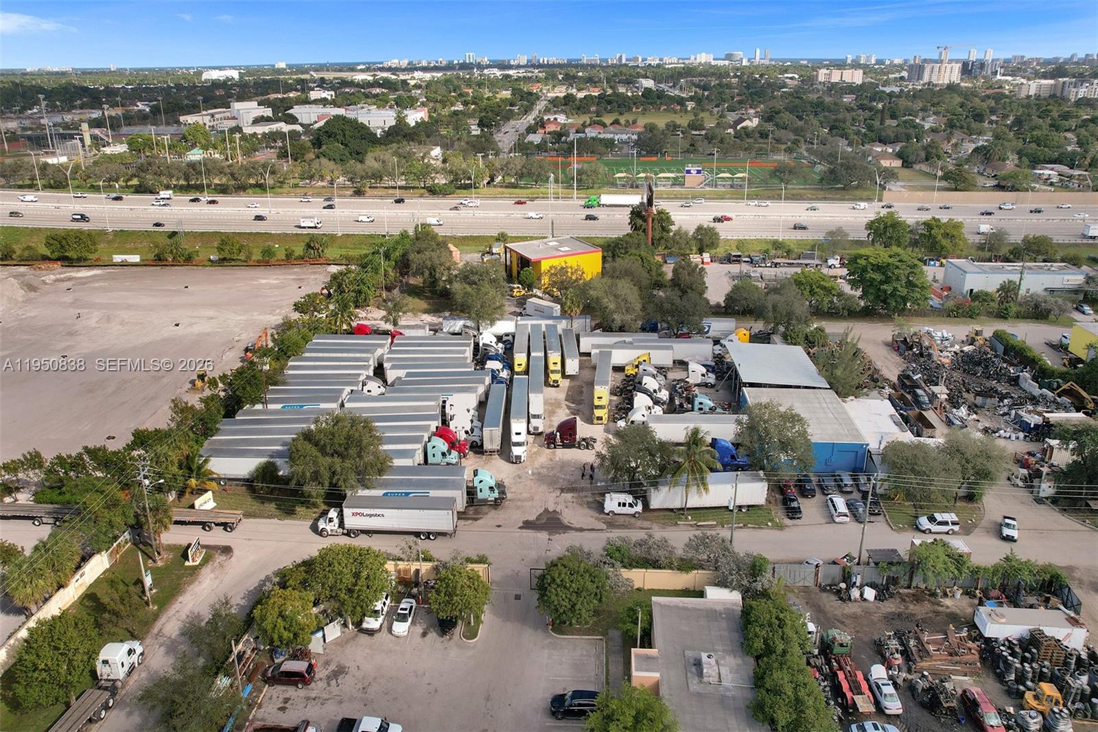 An aerial view shows a commercial truck storage yard with numerous trailers and vehicles — 850 NW 12th Ter, Pompano Beach FL 33069, POMPANO BEACH, FL