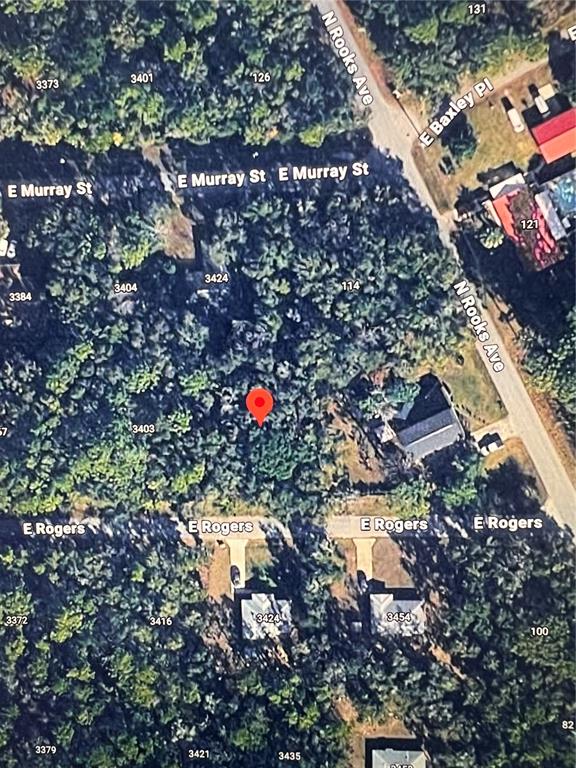 This is an aerial map view of a wooded residential lot marked with a pin — 3419 E ROGERS STREET, INVERNESS, FL