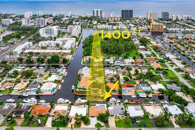 An aerial view shows a waterfront house with a boat dock and a canal — 1250 NE 27th Terrace, Pompano Beach FL 33062, POMPANO BEACH, FL