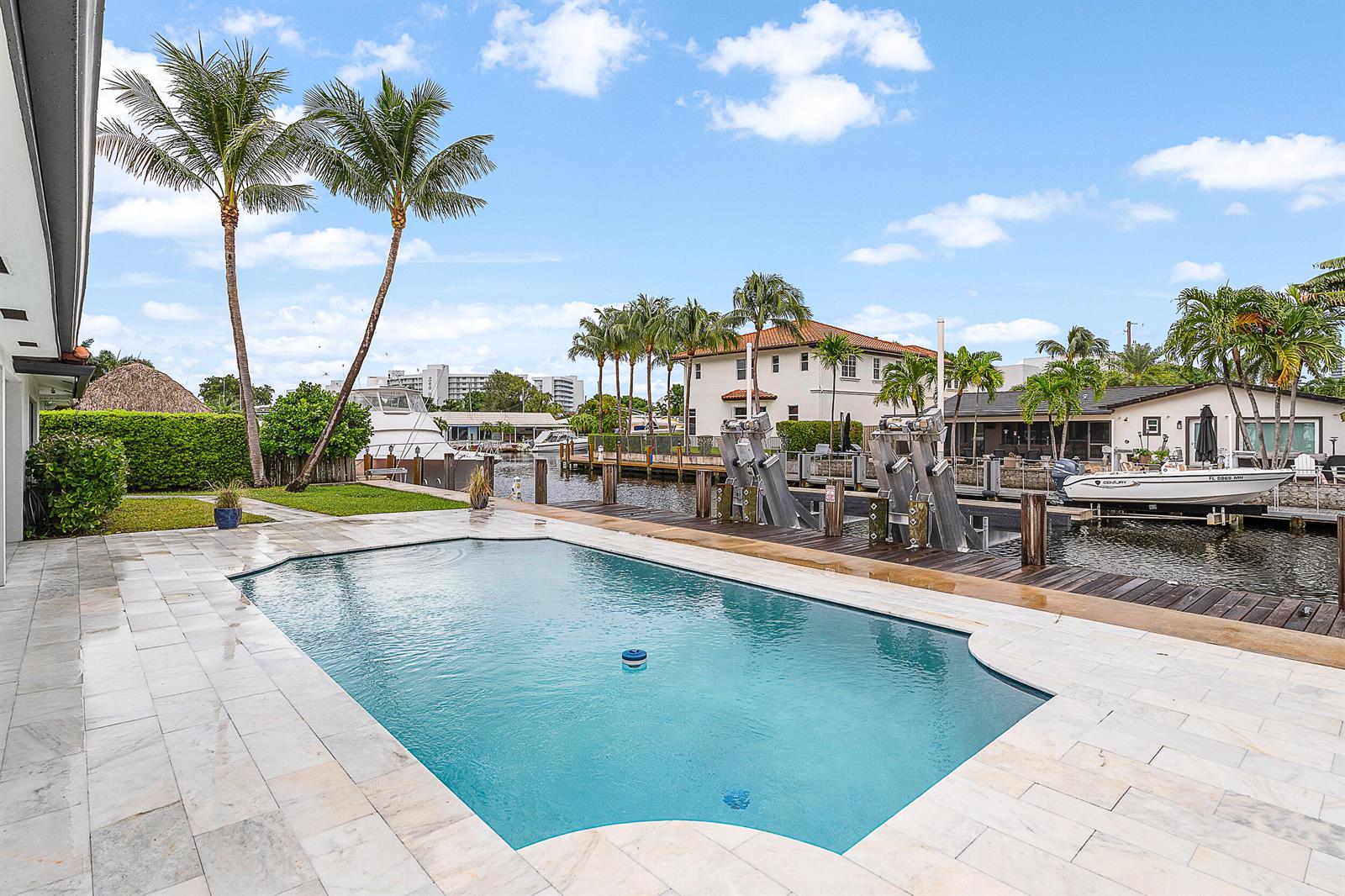 An aerial view shows a waterfront residential neighborhood with a highlighted property and canal access — 1250 NE 27th Terrace, Pompano Beach FL 33062, POMPANO BEACH, FL