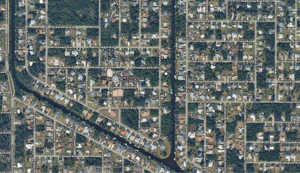 This is an aerial map view of a residential neighborhood with streets and houses — 2216 BARKSDALE STREET, PORT CHARLOTTE, FL