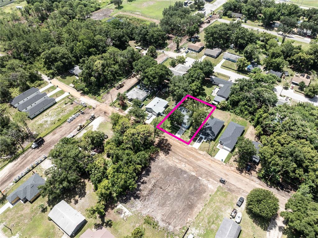 An aerial view shows a residential neighborhood with a highlighted house and surrounding lots — 2270 SUANEE AVENUE, EUSTIS, FL