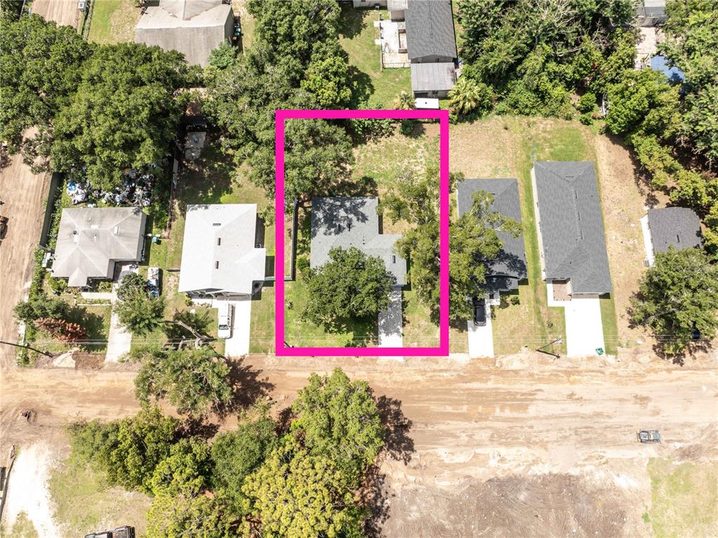 An aerial view shows a house highlighted by a pink rectangle on a residential street — 2270 SUANEE AVENUE, EUSTIS, FL