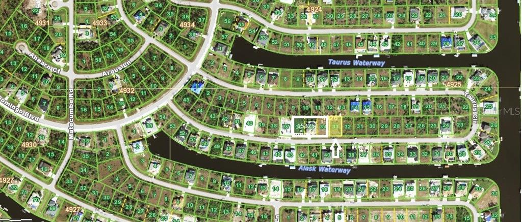 This is an aerial map showing residential lots and waterways in a suburban neighborhood — 15309 TAURUS CIRCLE, PORT CHARLOTTE, FL