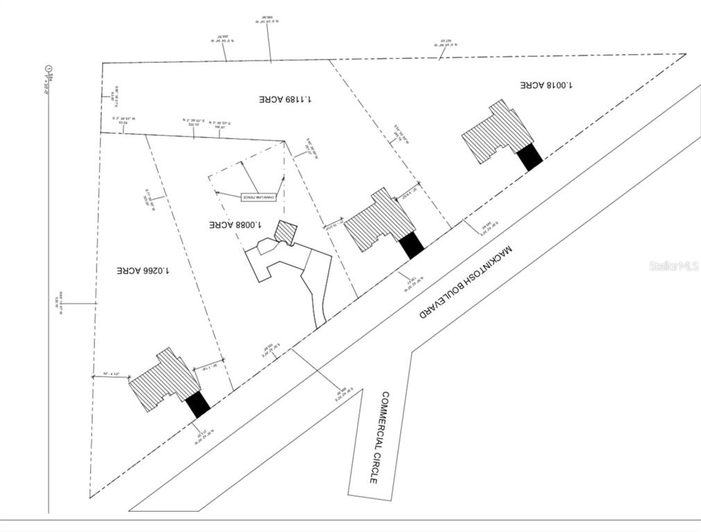 This is a land survey map showing four adjacent lots with buildings and road access — MACINTOSH BOULEVARD, NOKOMIS, FL
