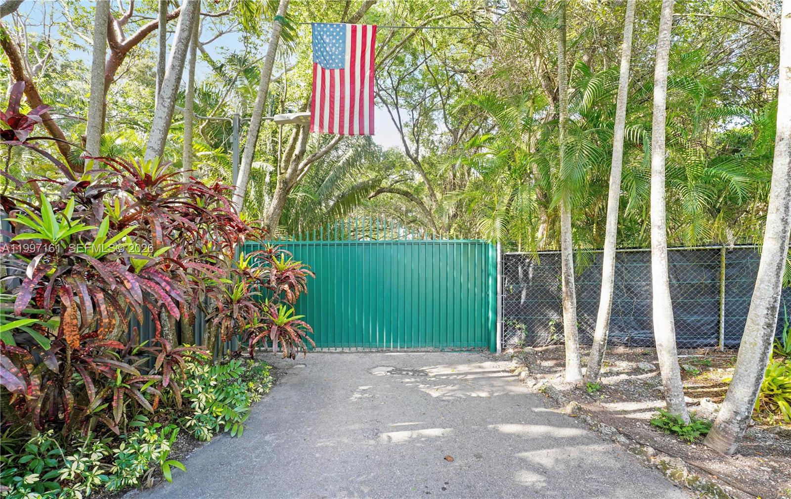 An open-air wooden pavilion features a bar, wagon wheel chairs, and string lighting at dusk — 15425 SW 268th St, Homestead FL 33032, HOMESTEAD, FL