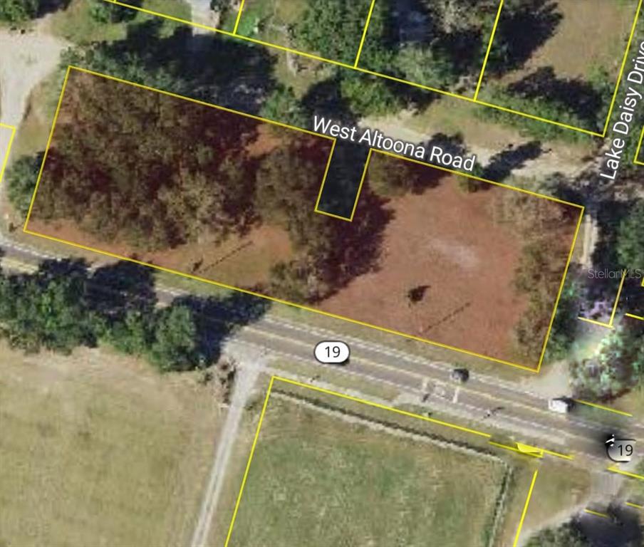 An aerial map view shows a rectangular plot of land bordered by two roads — 00 LAKE DAISY DRIVE, ALTOONA, FL