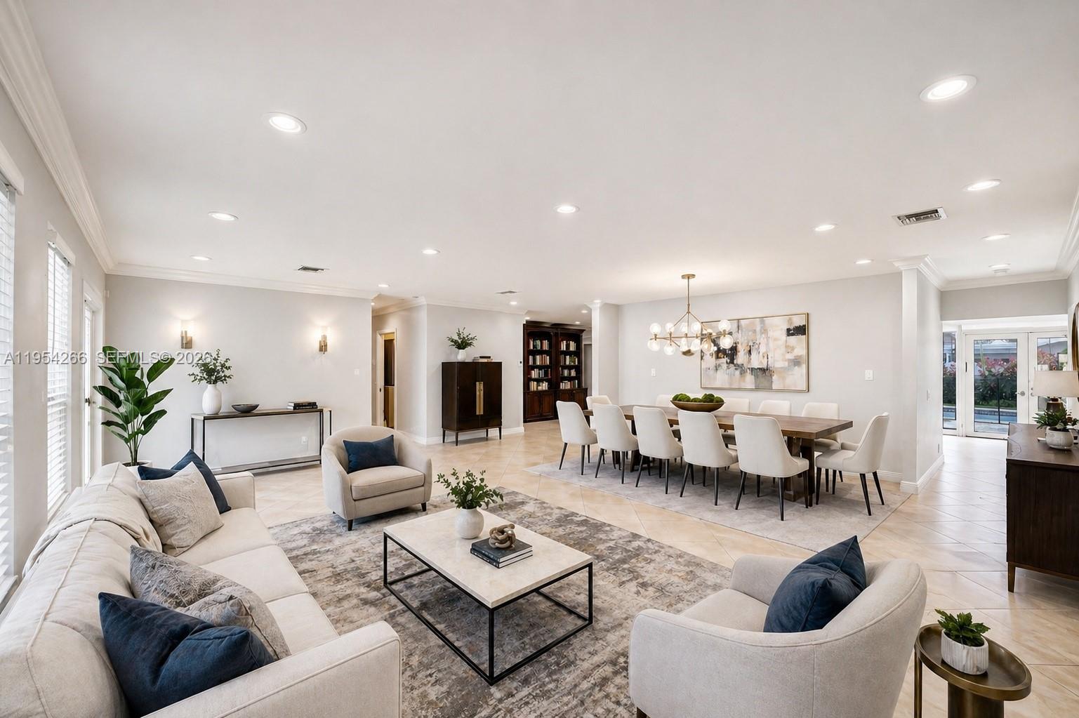 A spacious open-concept living and dining room with neutral furniture, tile floors, and recessed lighting — 3671 N 47th Ave, Hollywood FL 33021, HOLLYWOOD, FL