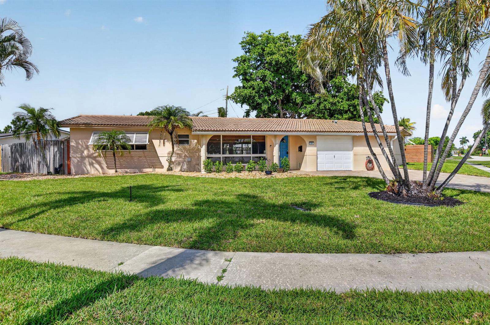 A single-story house with a beige exterior, a tiled roof, and a front lawn — 301 SE 8th Avenue, Deerfield Beach FL 33441, DEERFIELD BEACH, FL