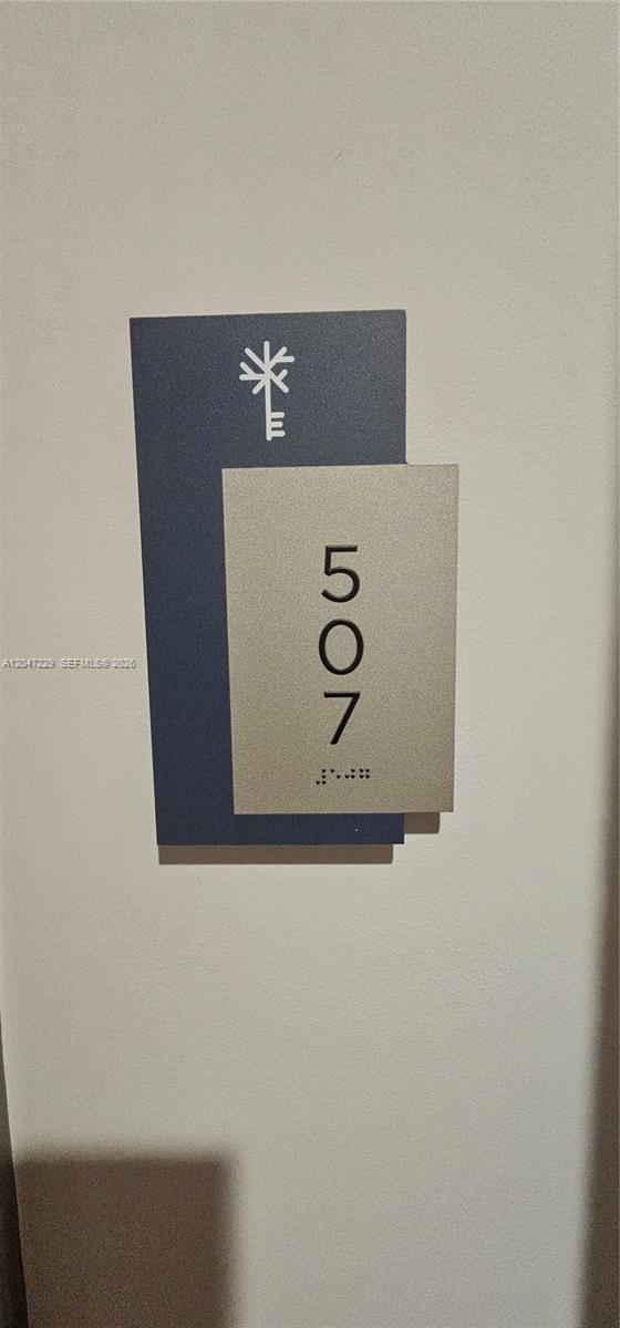 A room number sign for 507 is mounted on a plain wall — 5350 NW 84th Ave # 507, Doral FL 33166, DORAL, FL