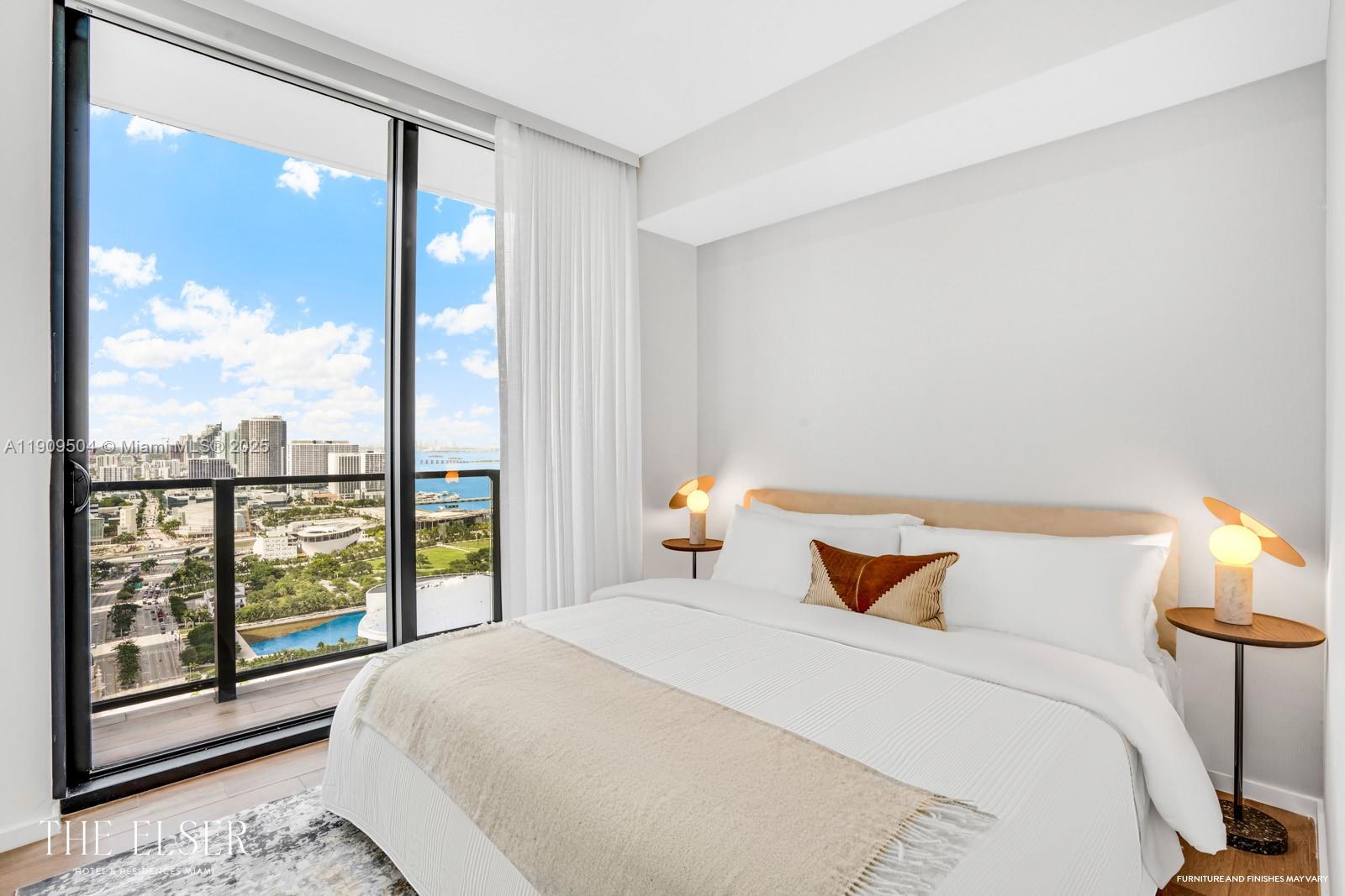 A modern bedroom features a bed with white linens, two side tables, and floor-to-ceiling windows — 398 NE 5th St # 1601, Miami FL 33132, MIAMI, FL