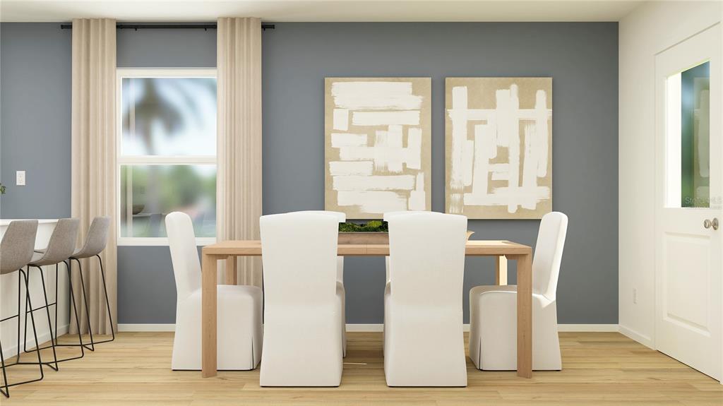 This rendering shows a dining area with a wooden table, white chairs, and abstract art — 2994 CHERRY LANE, HAINES CITY, FL