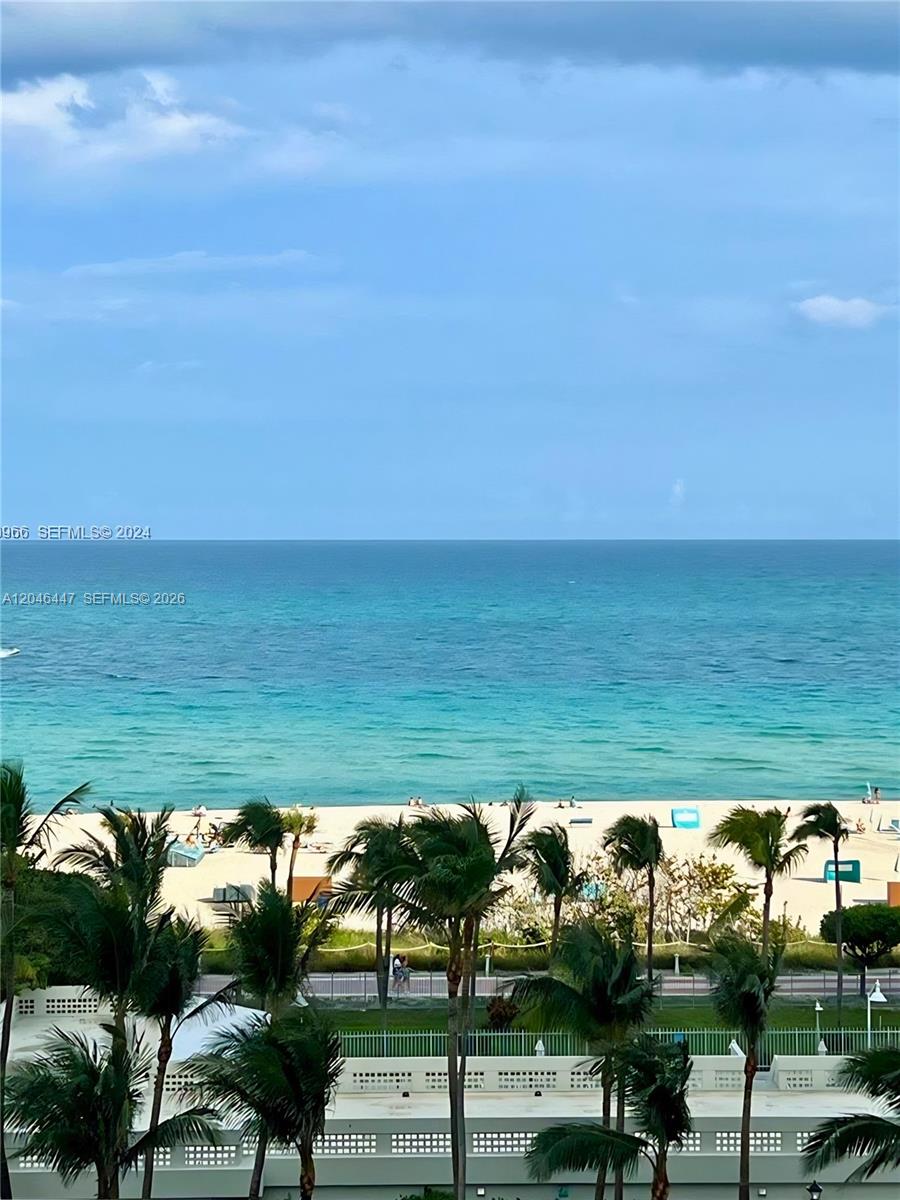 A view of a sandy beach and the ocean from an elevated vantage point — 2899 Collins Ave # 905, Miami Beach FL 33140, MIAMI BEACH, FL