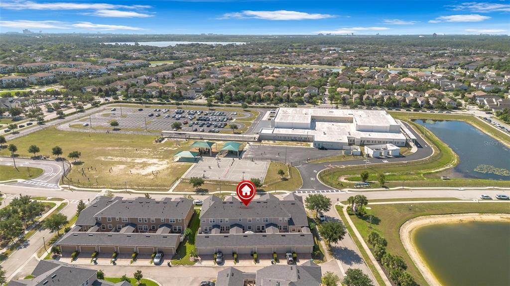 An aerial view shows a multi-unit townhouse complex with a red location marker — 11951 VERMILLION AVENUE, WINDERMERE, FL