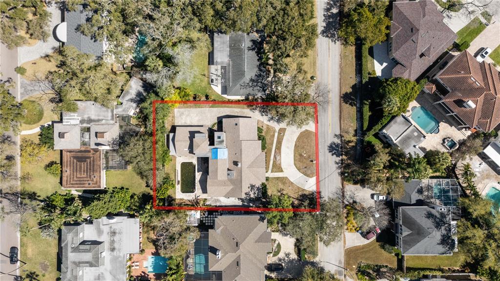 An aerial view shows a residential property with a house, pool, and driveway — 4205 W AZEELE STREET, TAMPA, FL