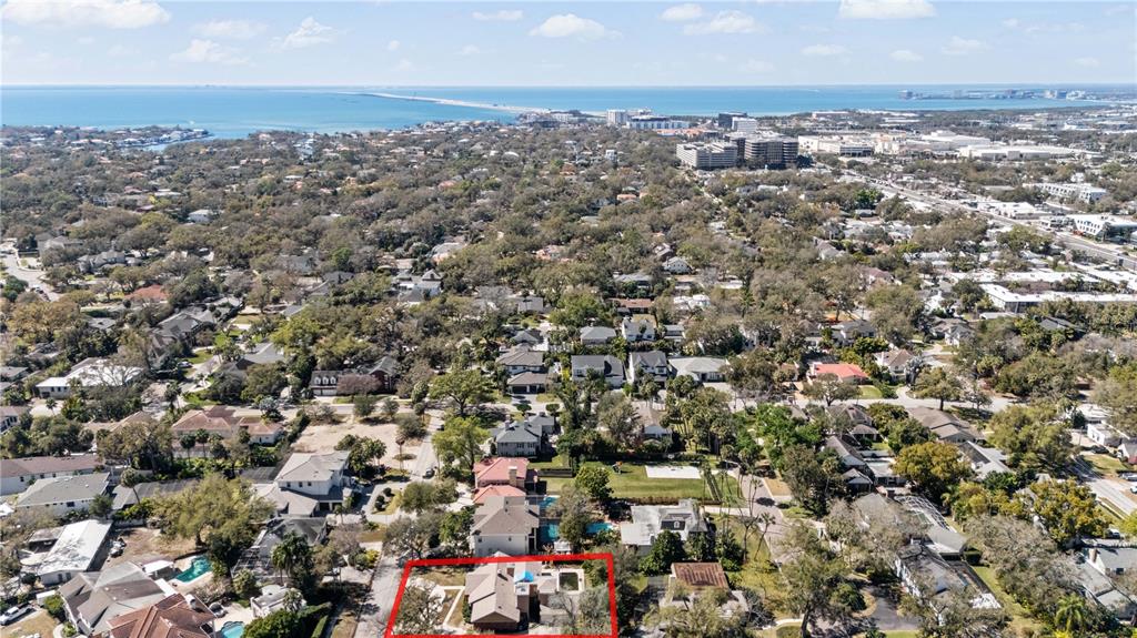 An aerial view shows a residential house with a pool outlined in red — 4205 W AZEELE STREET, TAMPA, FL