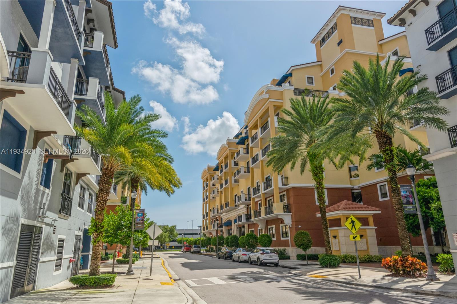 A street view shows multi-story apartment buildings with palm trees and parked cars — 8395 SW 73rd Ave # 417, Miami FL 33143, MIAMI, FL