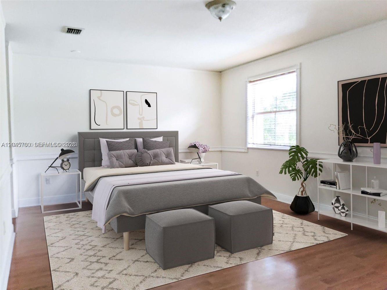 A bedroom features a gray upholstered bed, two matching ottomans, and a white shelving unit — 8853 SW 108th Pl, Miami FL 33176, MIAMI, FL