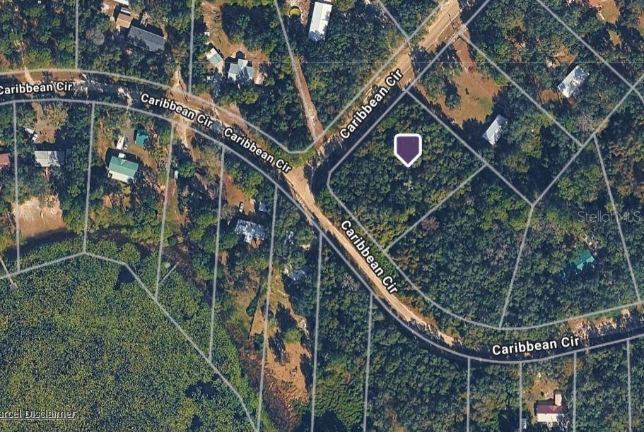 This is an aerial map view of a vacant, wooded residential lot on Caribbean Circle — 7469 CARIBBEAN CIRCLE, KEYSTONE HEIGHTS, FL