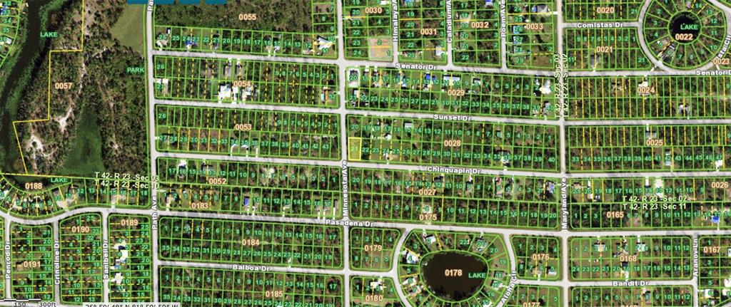 This is a satellite map showing residential land parcels and street layouts in a suburban area — 27396 CHINQUAPIN DRIVE, PUNTA GORDA, FL
