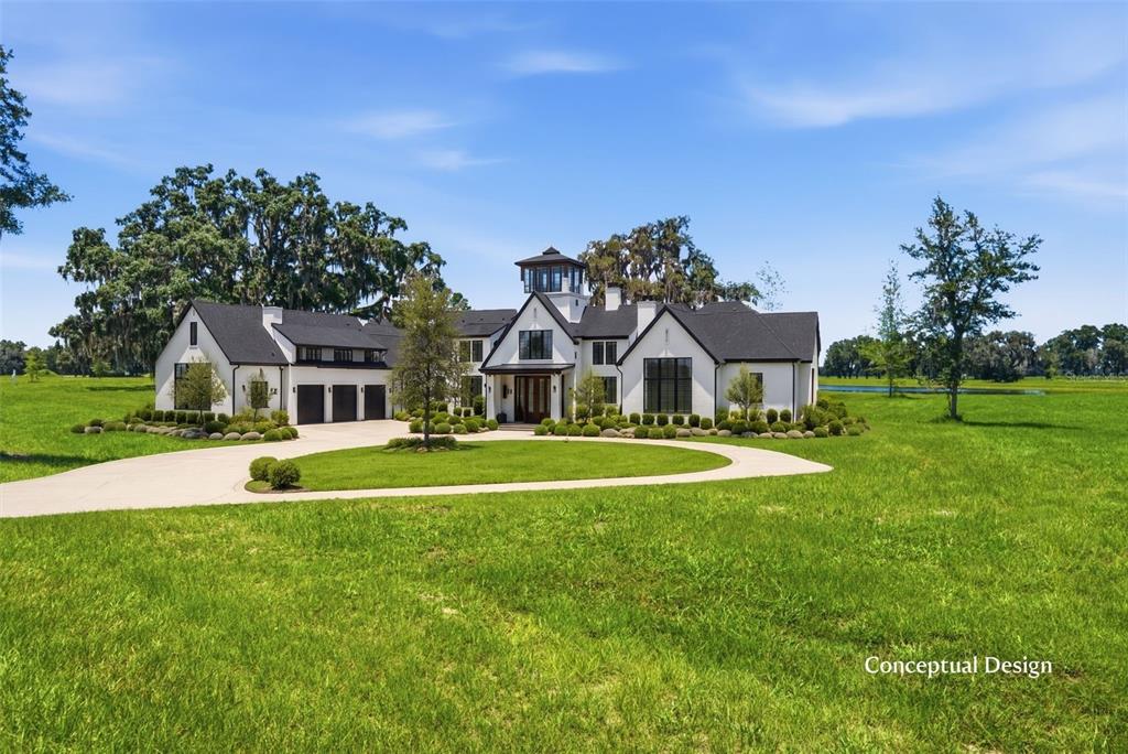 This is a digital rendering of a white modern farmhouse with a central cupola — TBD (Lot 22-W) SW 138TH LOOP, DUNNELLON, FL