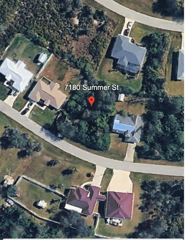 This is an aerial map view of a residential lot with surrounding houses and trees — 7180 SUMMER STREET, ENGLEWOOD, FL