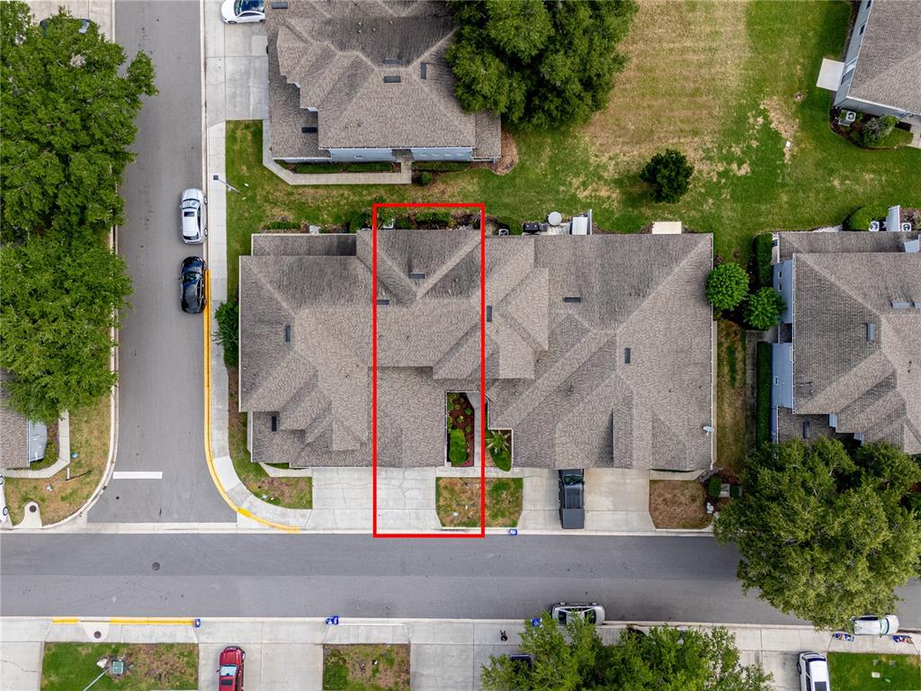 An aerial view shows a residential building with a red rectangle highlighting a specific unit — 1304 SANDSTONE RUN, SANFORD, FL