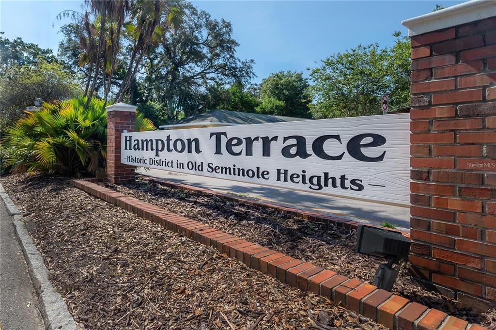 A brick-pillared sign displays the name Hampton Terrace in a historic district — 5530 N 9TH STREET UNIT 2, TAMPA, FL