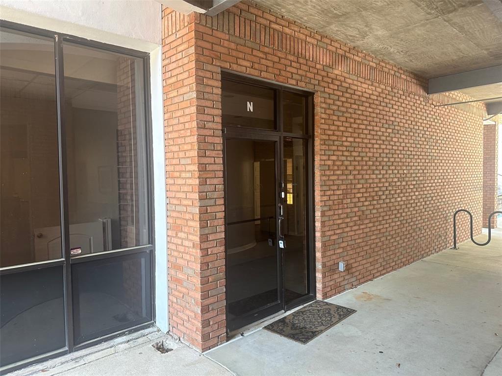 An exterior view of a brick building entrance marked with the letter N — 2770 NW 43RD STREET UNIT N, GAINESVILLE, FL