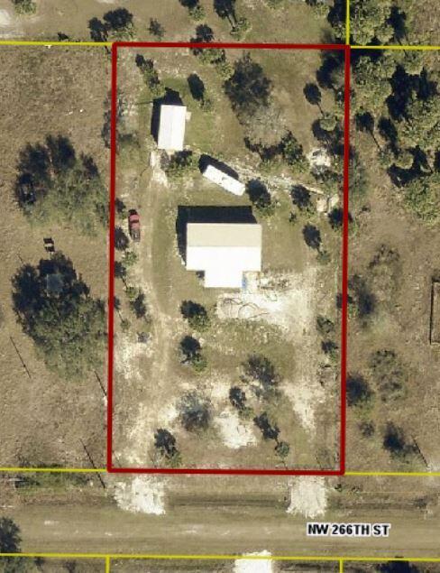 An aerial view shows a rectangular property lot containing a house, shed, and vehicle — 19835 NW 266 Street, Okeechobee FL 34972, OKEECHOBEE, FL