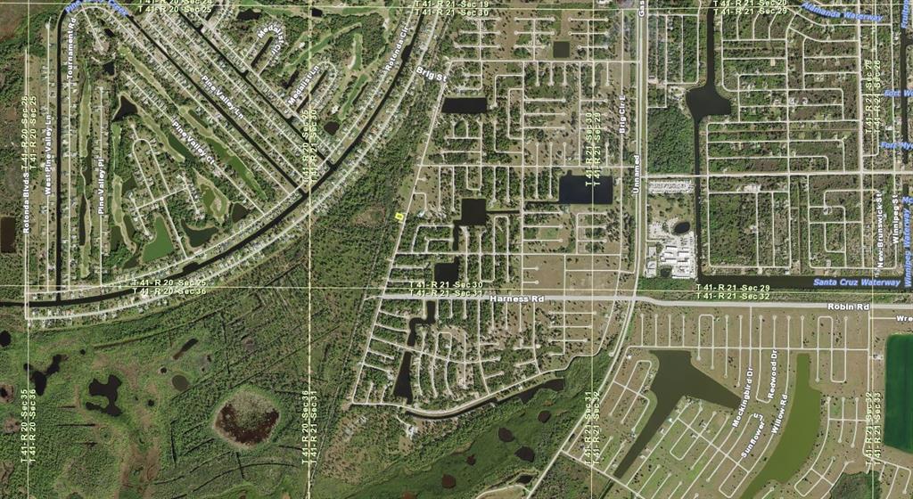 This is an aerial map view of a residential neighborhood with streets and waterways — 193 BRIG CIRCLE W, PLACIDA, FL