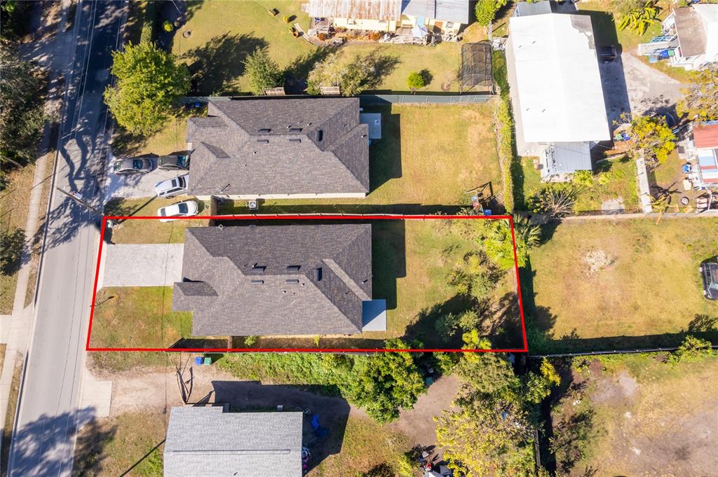 An aerial view shows a residential property outlined in red with a house and yard — 1519 INDIANA STREET, ORLANDO, FL