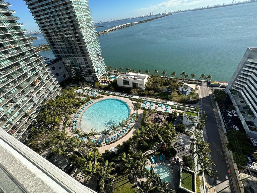High-angle view of a residential complex featuring a large circular swimming pool and waterfront — 480 NE 31st St # 905, Miami FL 33137, MIAMI, FL